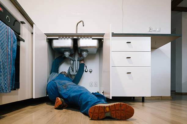 Professional Drain Cleaning technician working in Alturas, FL